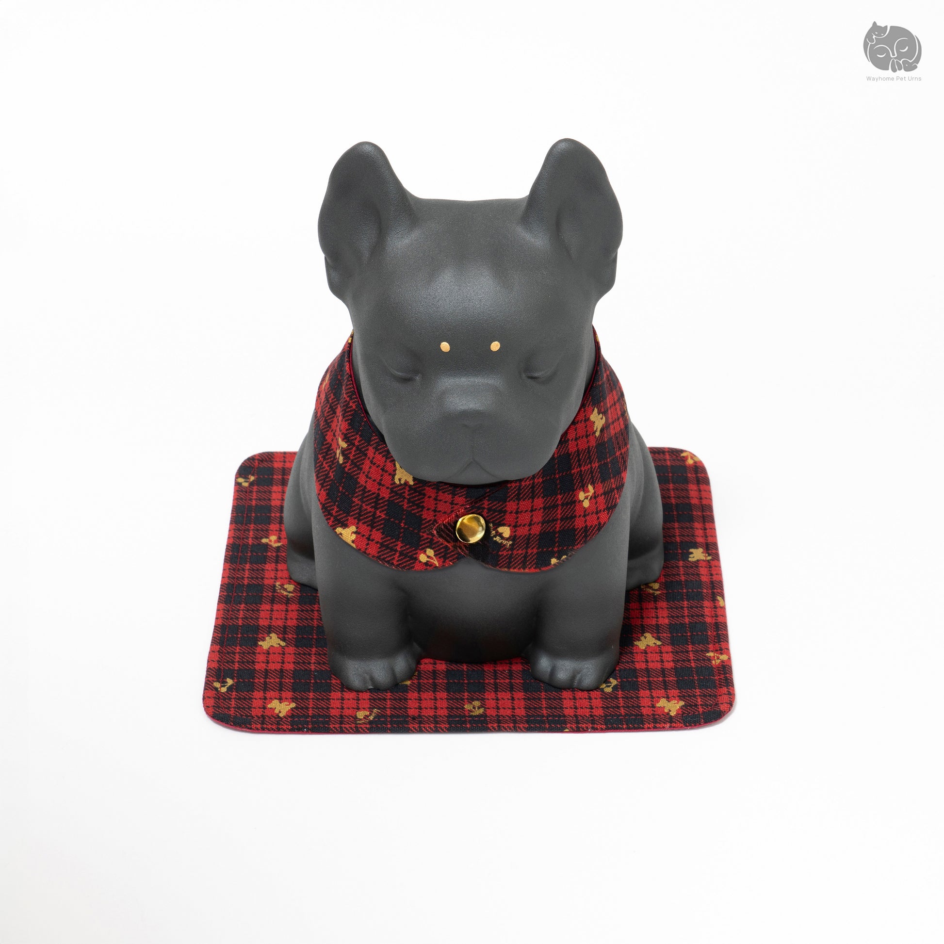 Slightly top-down front view of the Wayhome bulldog urn, showing the golden eye details.