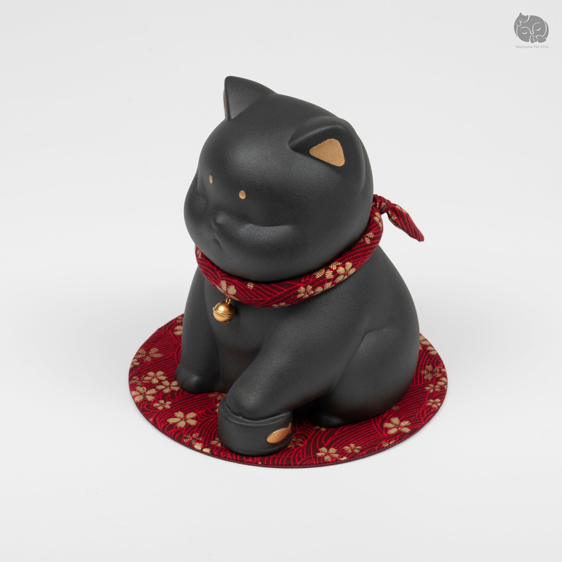 Angled front view of the black cat ceramic urn, perfect for a minimalist pet memorial altar at home.