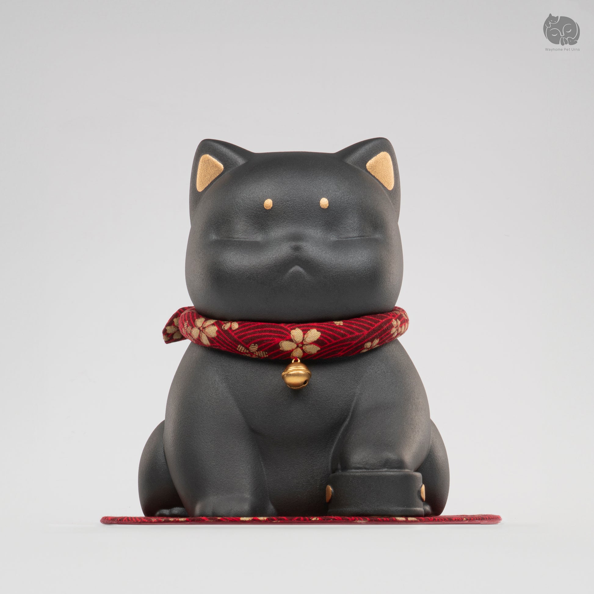 Front view of the Wayhome obsidian black cat ceramic urn with a red bell collar, a peaceful memorial for cats.