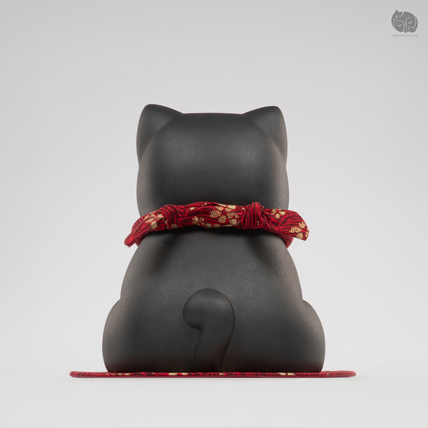 Back view of the Wayhome obsidian black cat keepsake urn, highlighting the seamless handmade finish.