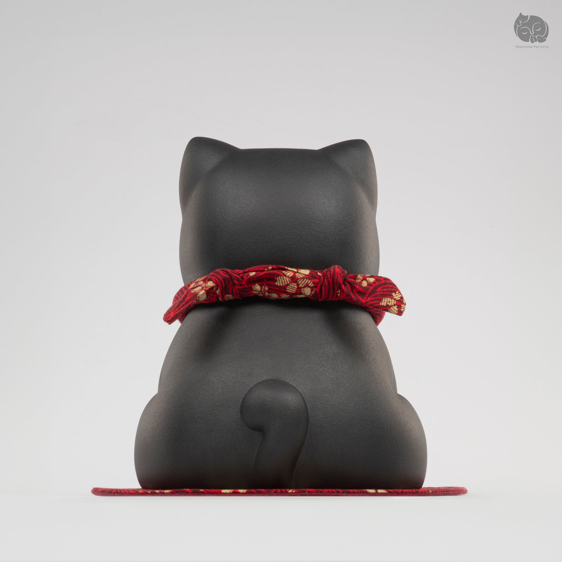 Back view of the Wayhome obsidian black cat keepsake urn, highlighting the seamless handmade finish.