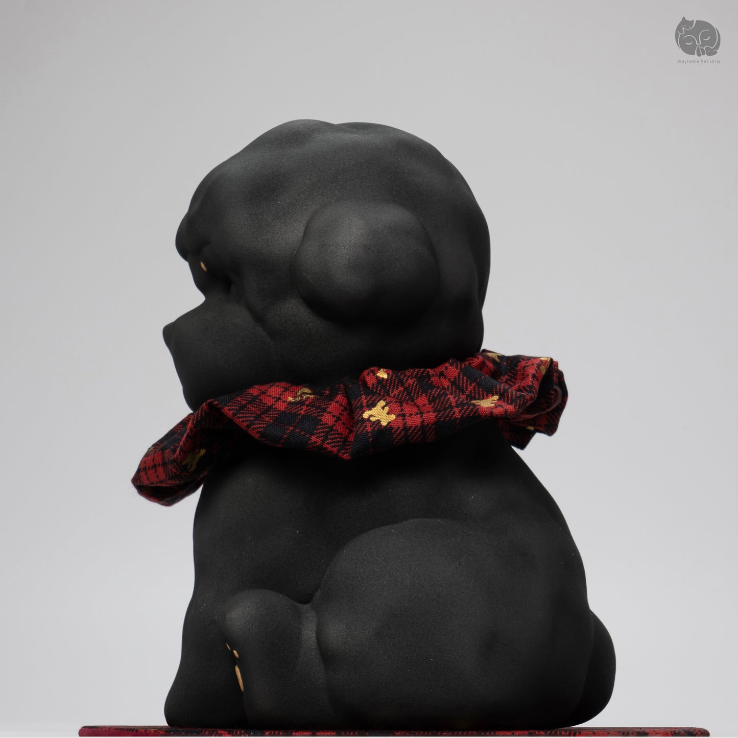 Back view of the Wayhome black dog memorial jar, highlighting the artisan ceramic craftsmanship and secure base.