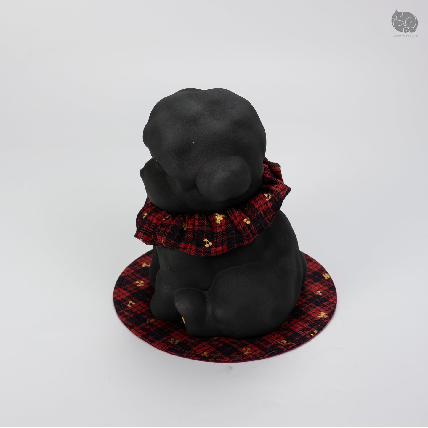Angled side view of the black ceramic dog urn, showcasing the minimalist sculpture for Teddy and Poodle.