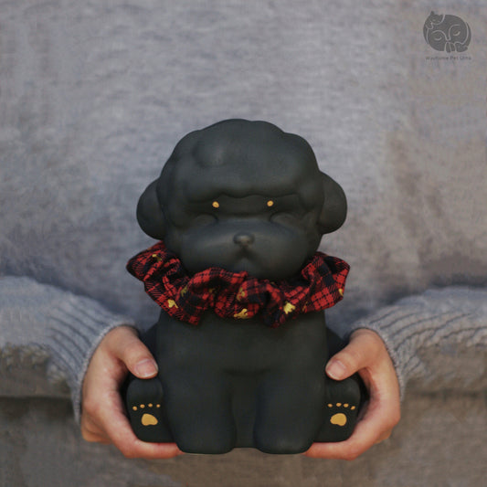 Wayhome obsidian black ceramic dog urn for Poodle and Bichon, held in hands to show actual size and matte texture.