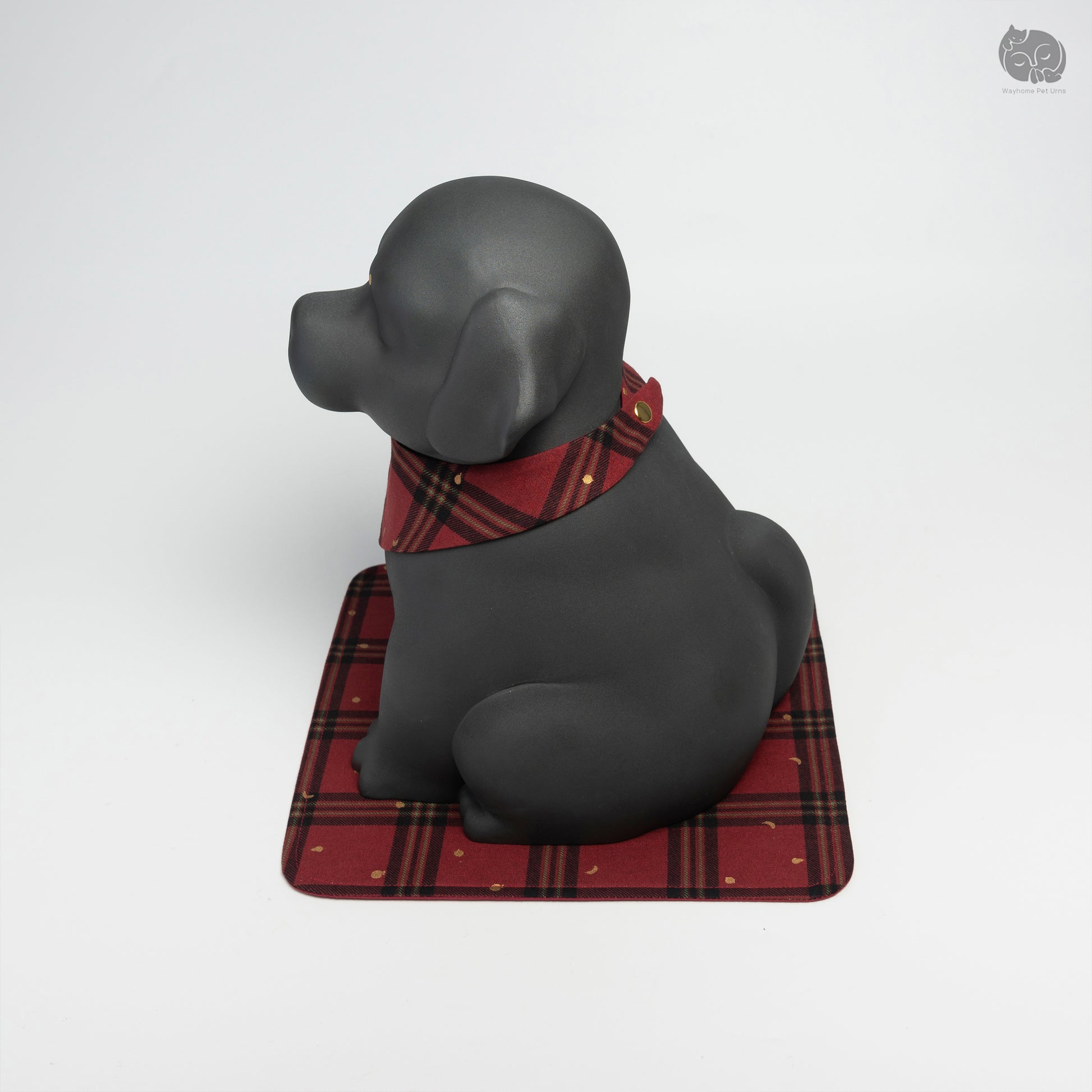 Angled back view of the Wayhome large breed dog urn on a red mat, a peaceful memorial for Golden Retrievers.