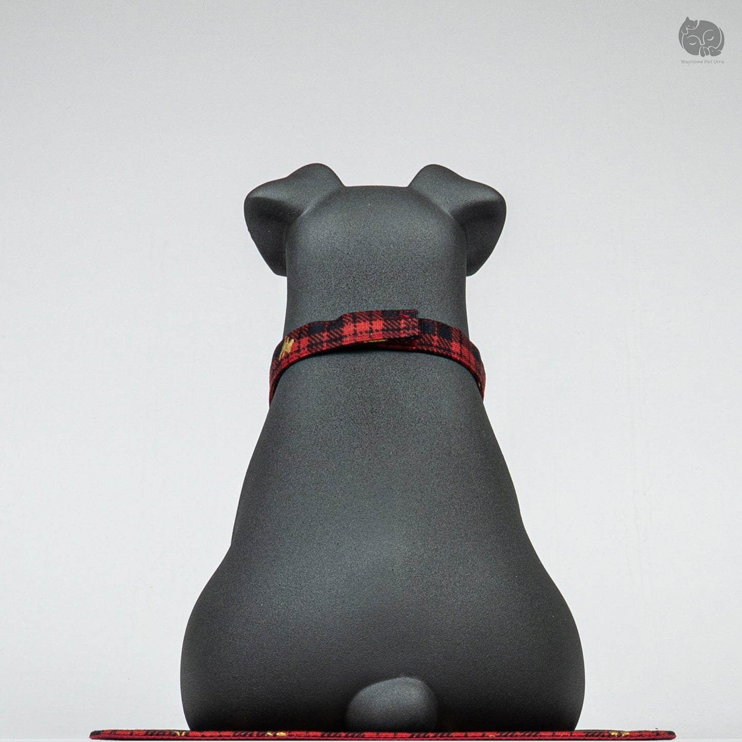 Back view of the Wayhome black Terrier keepsake urn, highlighting the seamless artisan ceramic work and secure base.