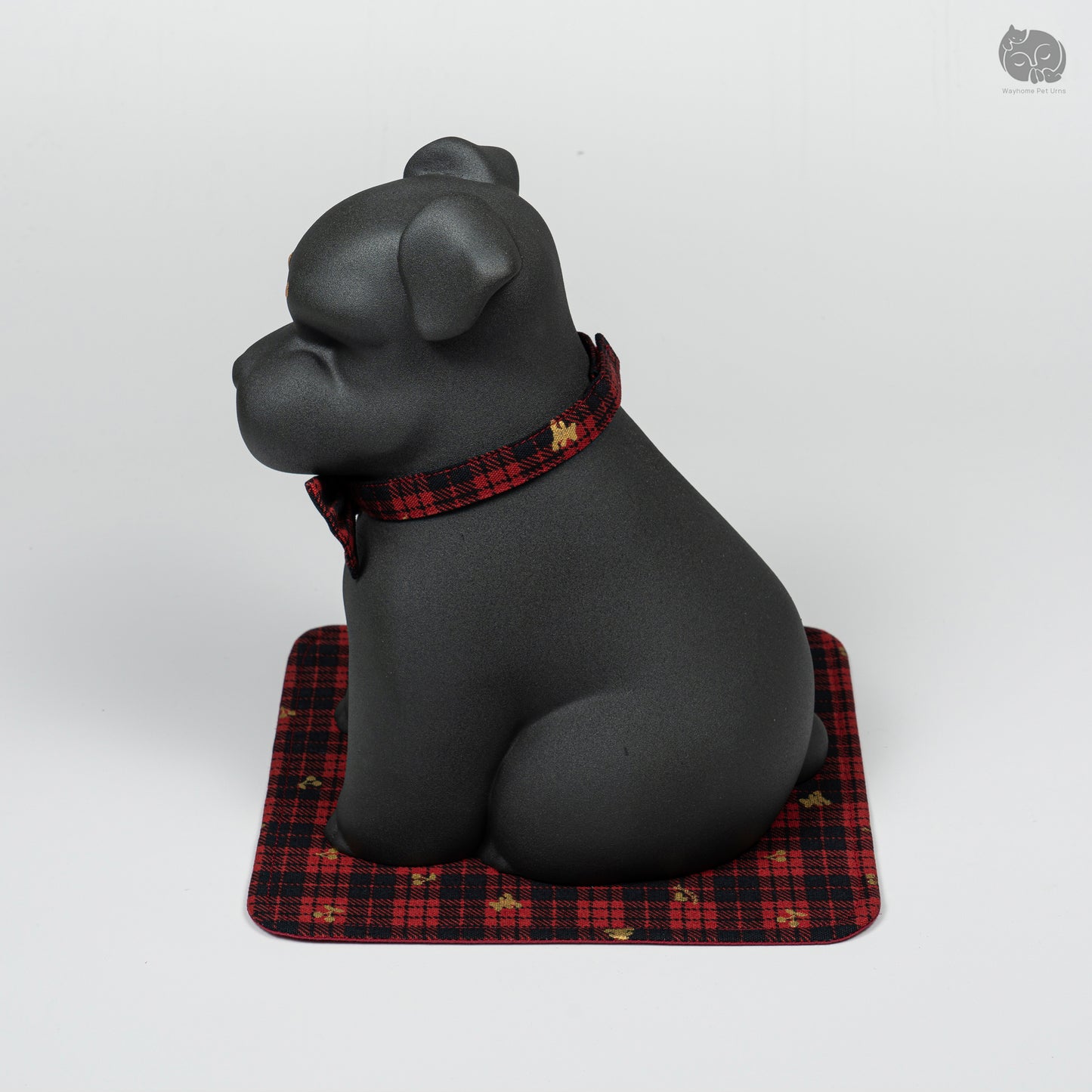 Angled side profile of the black ceramic dog urn for Terrier breeds, perfect for a pet memorial altar at home.