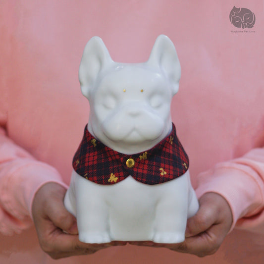 Wayhome ivory white ceramic dog urn for Bulldog, held in hands to show actual size reference.