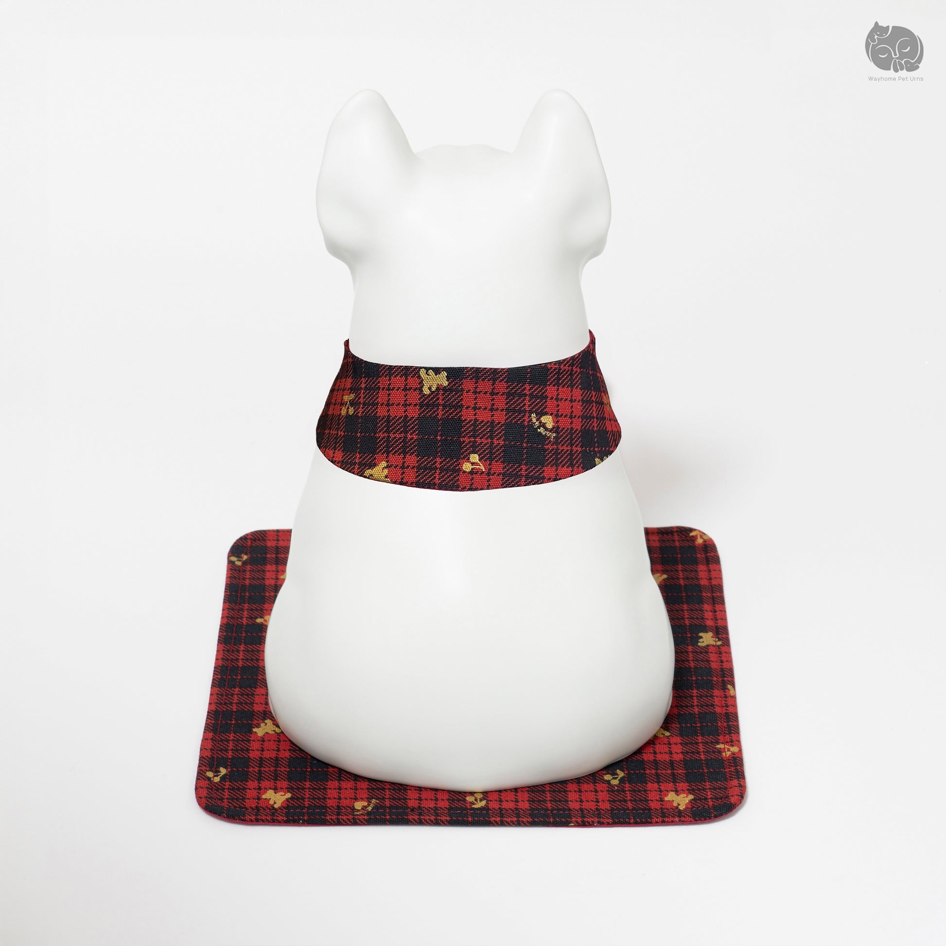 Angled back view of the white dog ashes keepsake, highlighting the sturdy base and decorative mat.