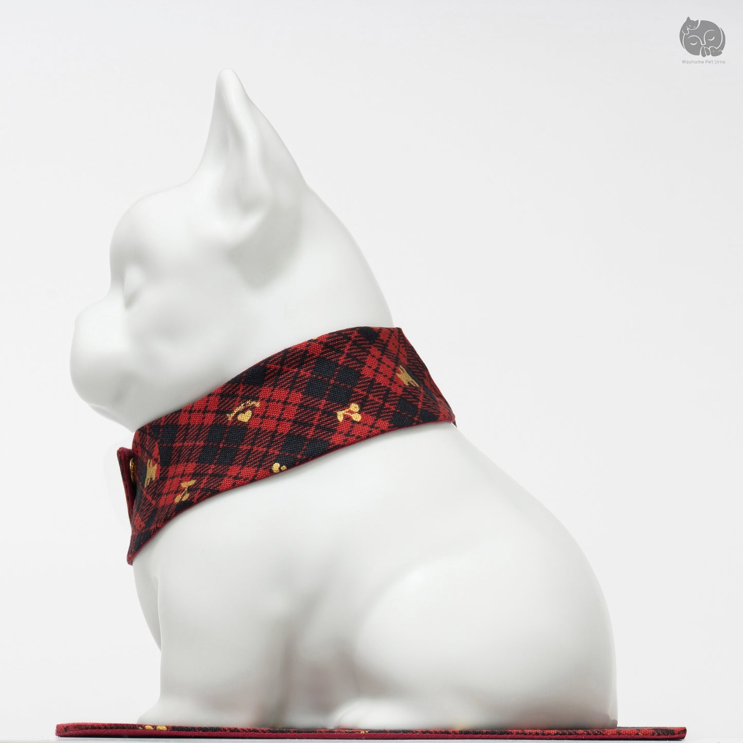 Right side profile of the white ceramic Bulldog memorial urn, showing the detailed plaid collar.