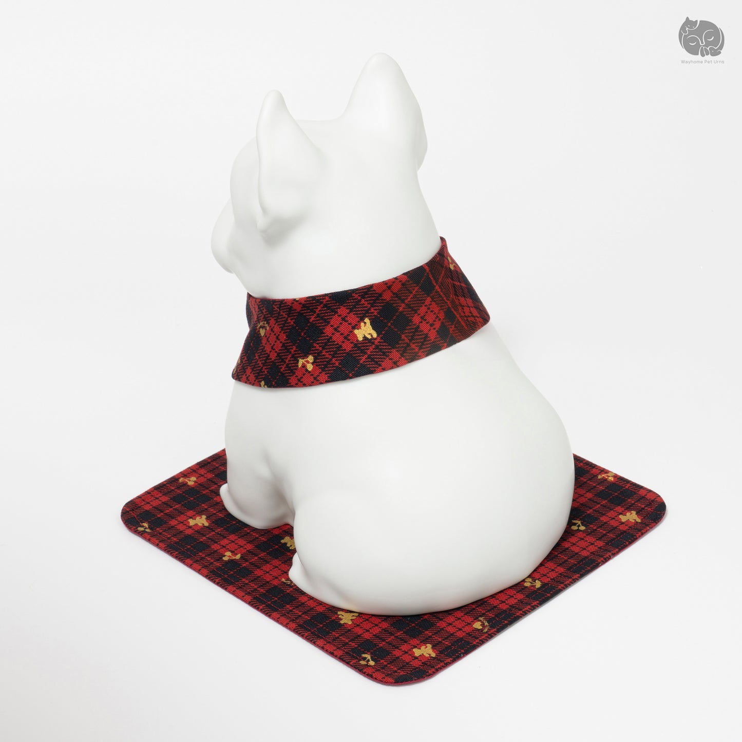 Angled side view of the ivory white ceramic dog urn, perfect for a memorial altar setup.