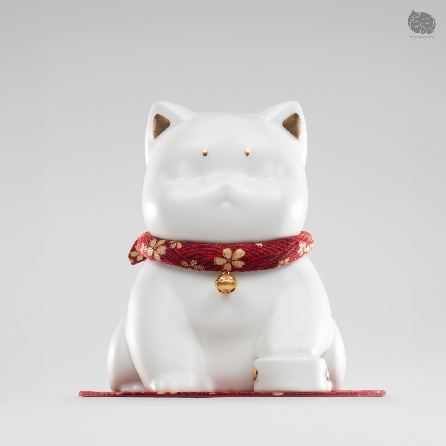 Front view of the ivory white cat ceramic urn with a red bell collar, a peaceful memorial for beloved cats.