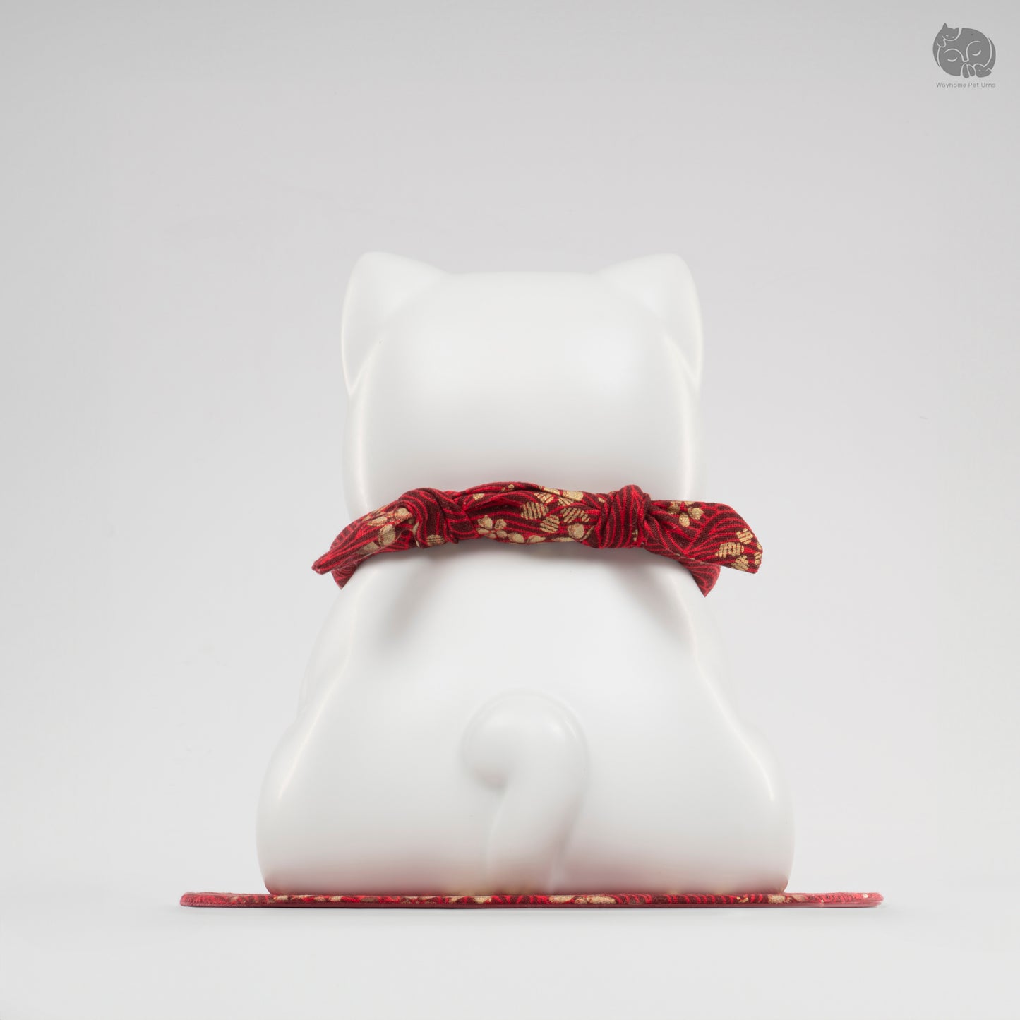 Back view of the Wayhome ivory white cat keepsake urn, highlighting the seamless handmade craftsmanship.