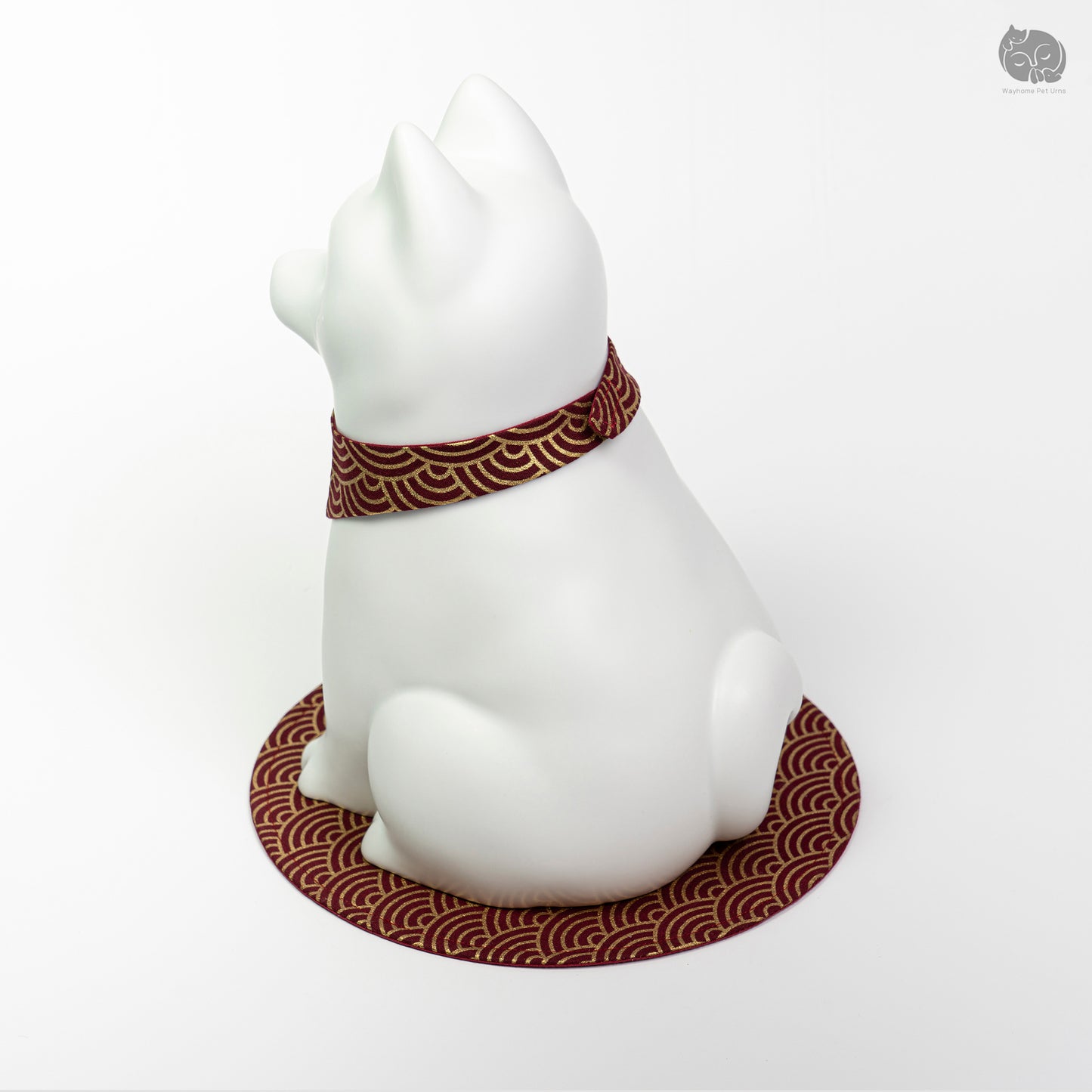 Rear quarter view of the ivory white dog urn, showing the calm expression and sturdy handcrafted base.