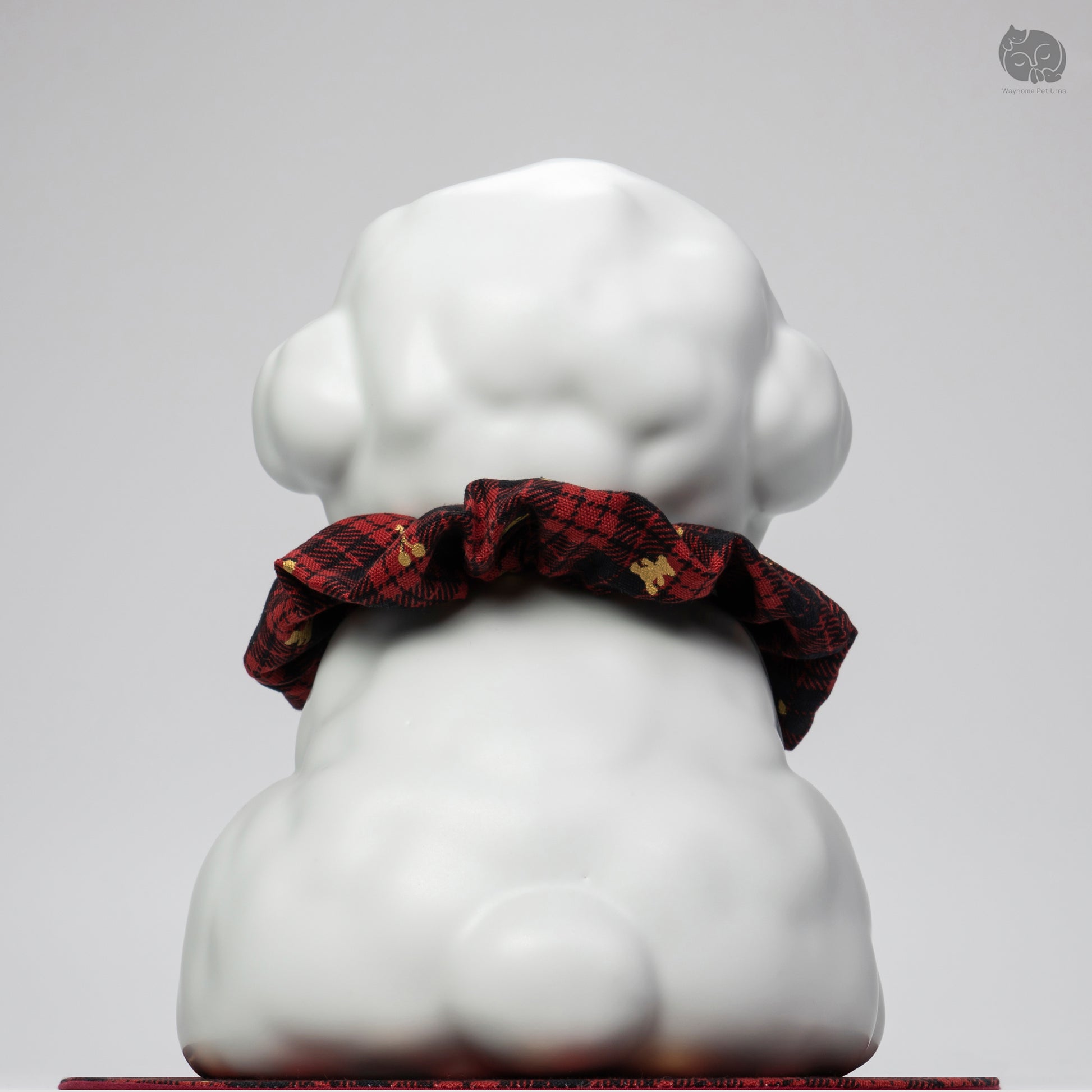 Back view of the Wayhome ivory white dog memorial jar, highlighting the smooth ceramic finish and secure base.