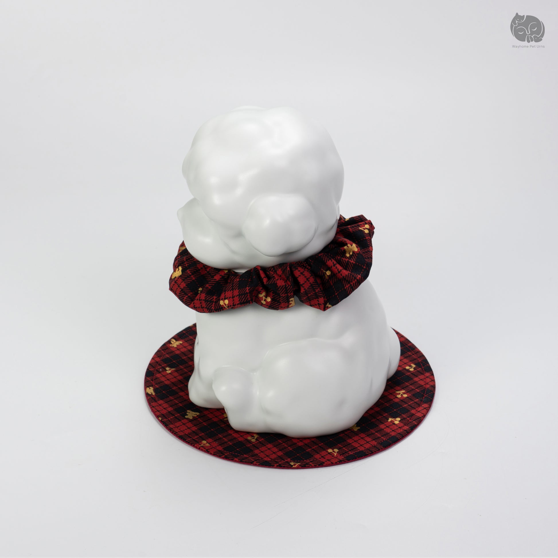 Angled side view of the white ceramic dog urn, showcasing the minimalist sculpture for Teddy and Poodle.