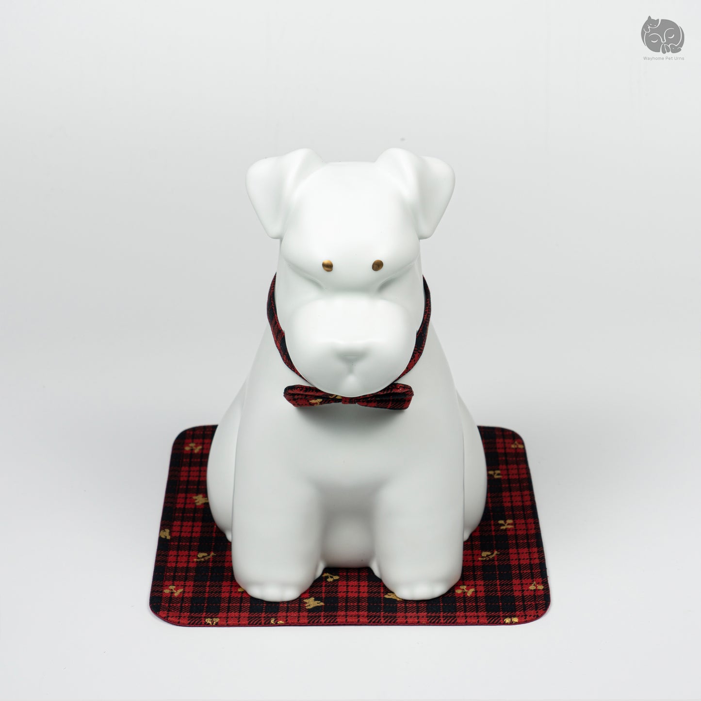 Front quarter view of the handcrafted white Terrier memorial keepsake, featuring the elegant red plaid bow tie.