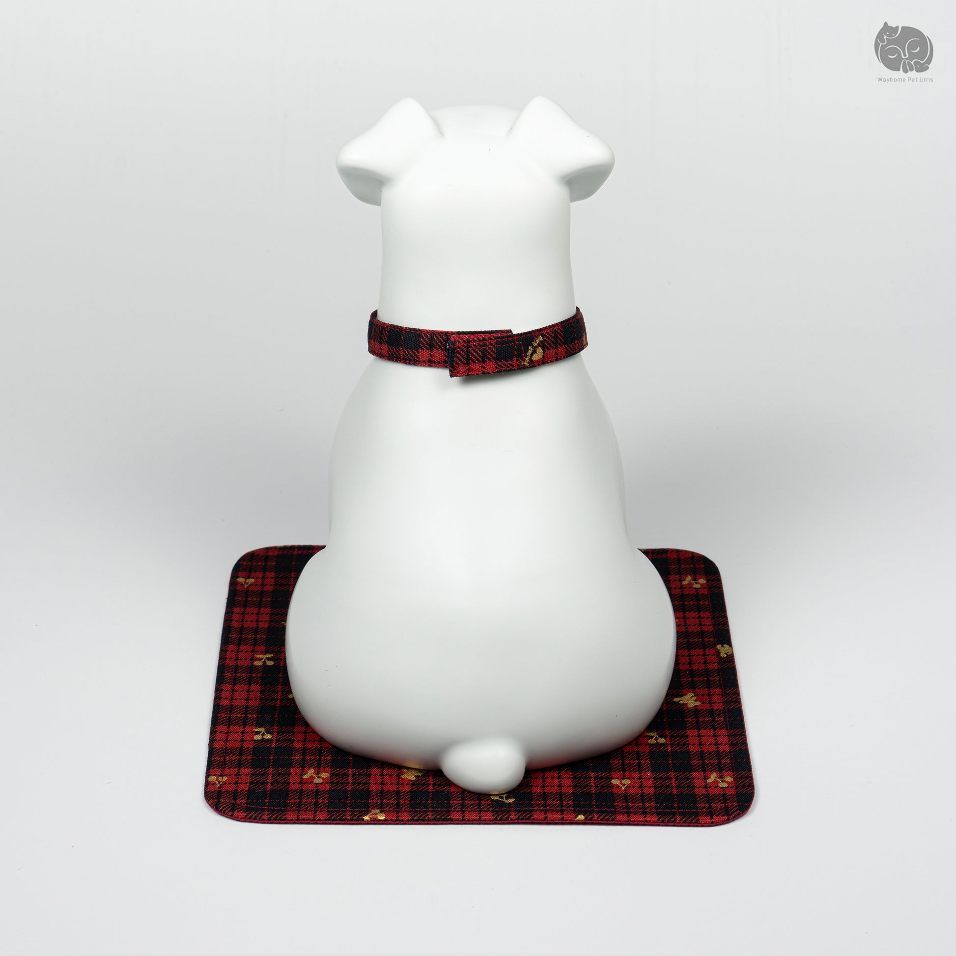 Rear quarter view of the white ceramic Terrier memorial jar, showcasing the artistic pet tribute for home decor.