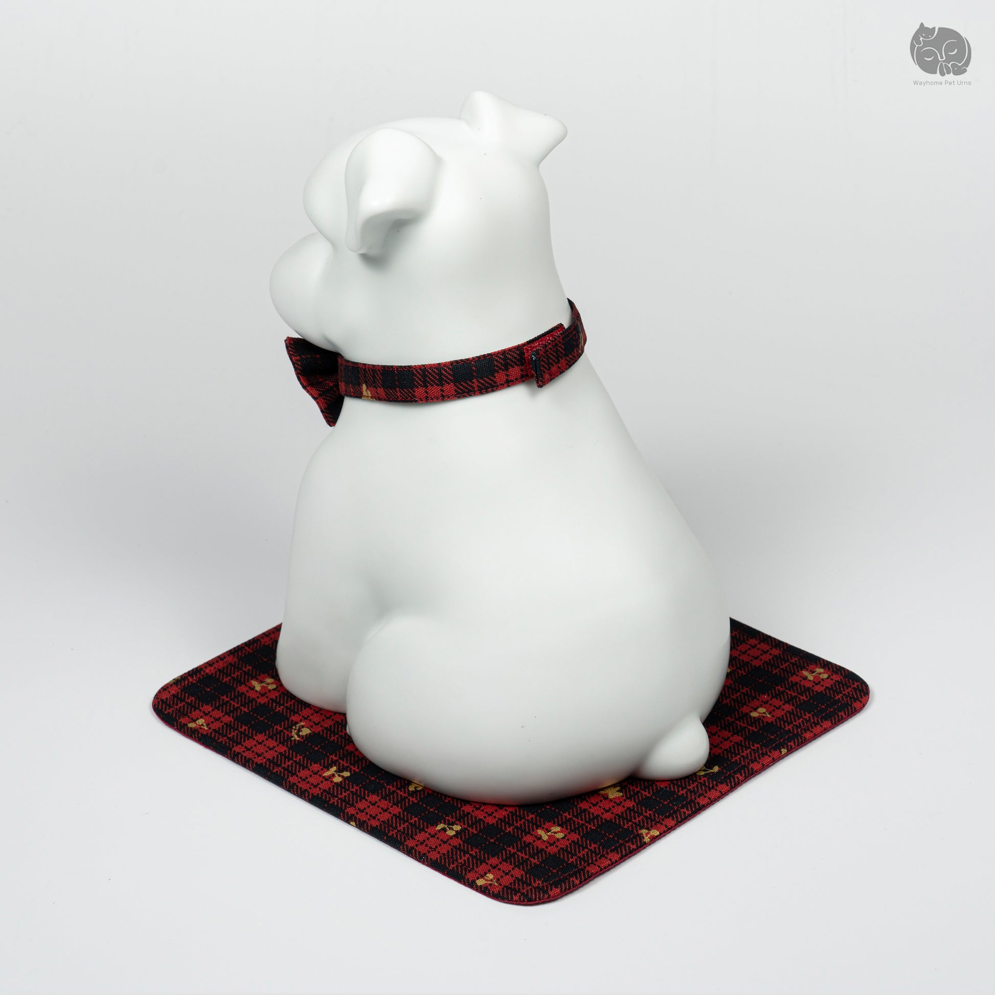 Top-down rear view of the Wayhome white Terrier ceramic urn, showing the peaceful artisan expression and signature mat.